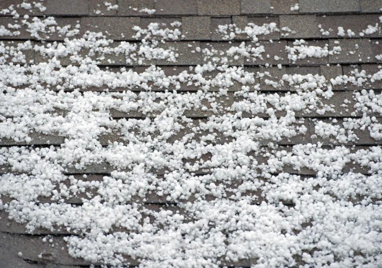 hail damage-hail on a shingled roof