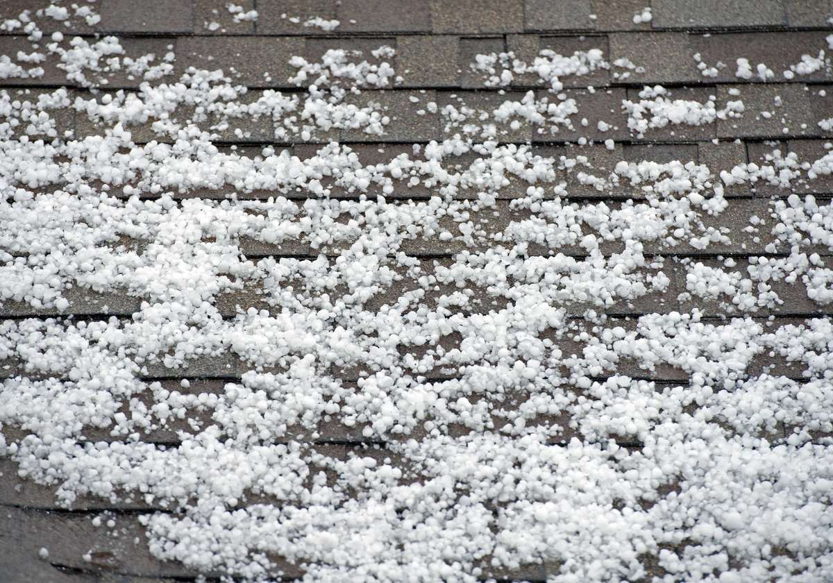 hail damage-hail on a shingled roof