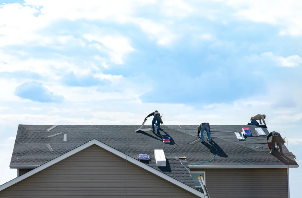 install roof shingles-view of a home with its roof being laid