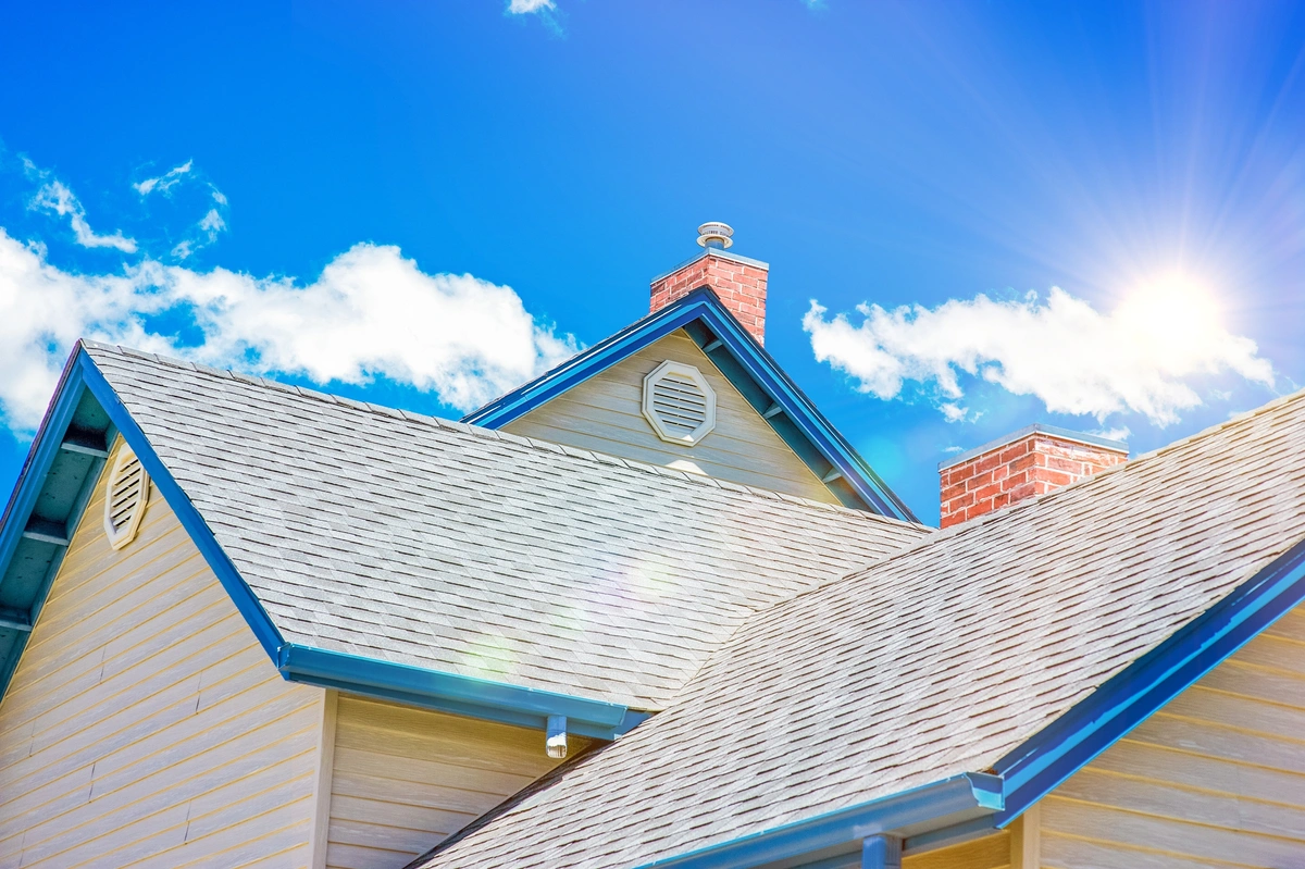new roofing on house with blue trim