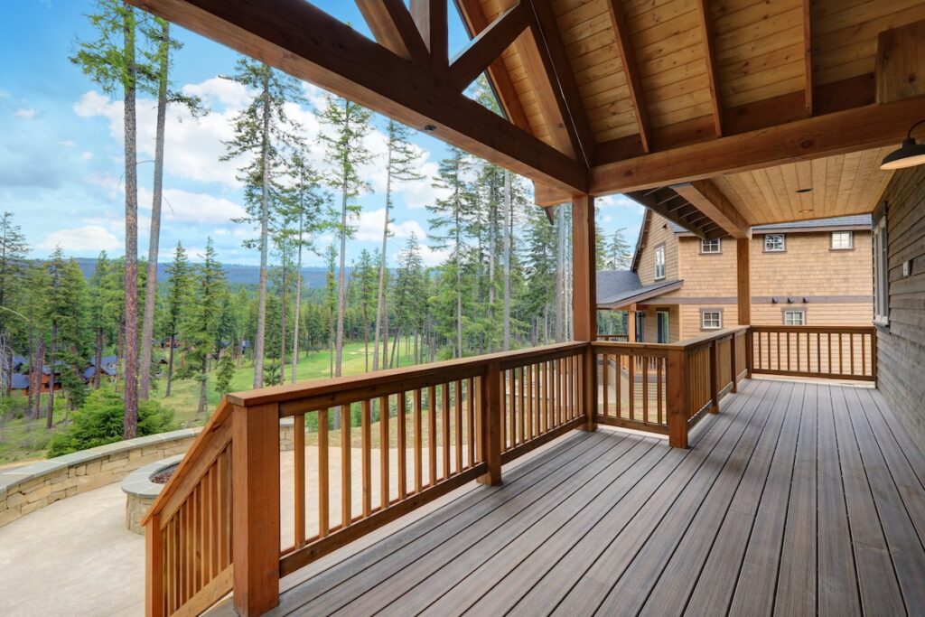 Beautiful large deck with stone patio and covered large roof ceiling.