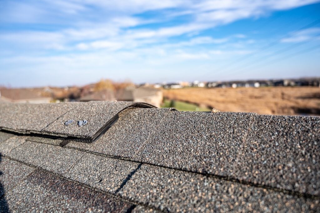 Typical residential ridge cap on a shingle roof apex