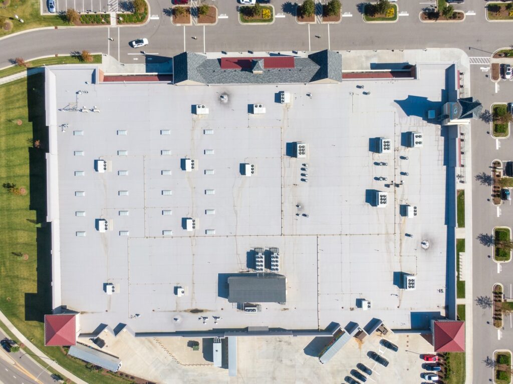 Drone Images of TPO Flat Commercial Roof With Metal Panels: New & Existing Construction