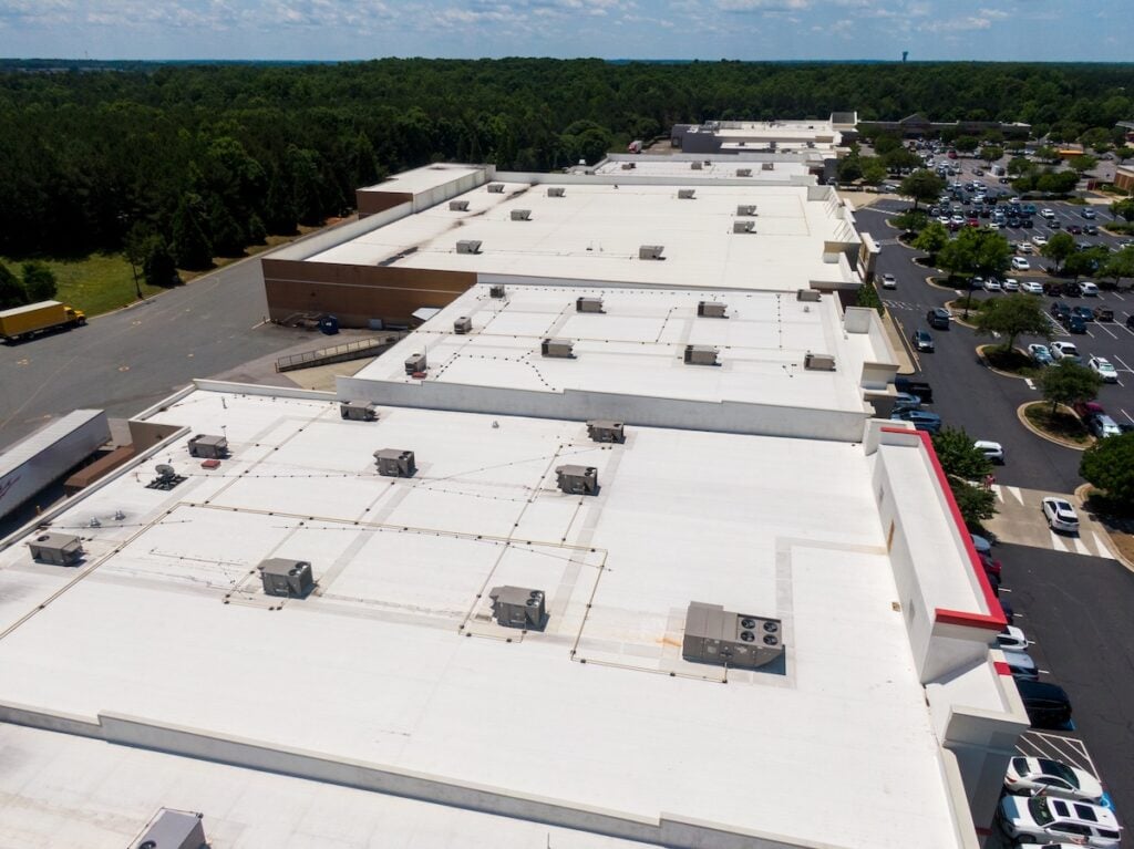 Drone Images of Commercial Roofs Featuring TPO and Asphalt Shingles: Midday, Sunny, No People
