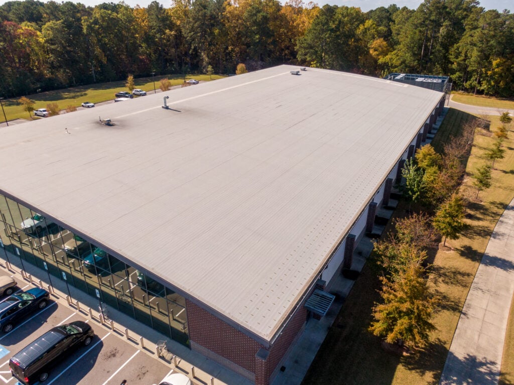 Sunny Daytime Drone Images of a Large Commercial Roof.