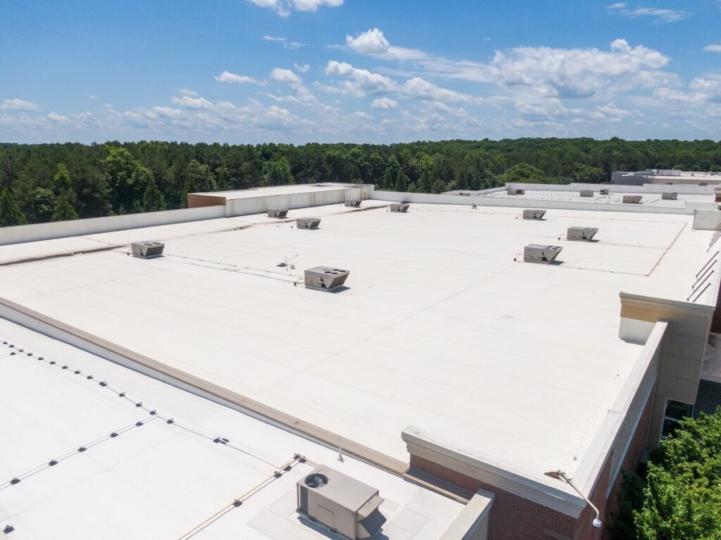 commercial flat roofing Drone Images of Commercial Roofs Featuring TPO and Asphalt Shingles: Midday, Sunny, No People