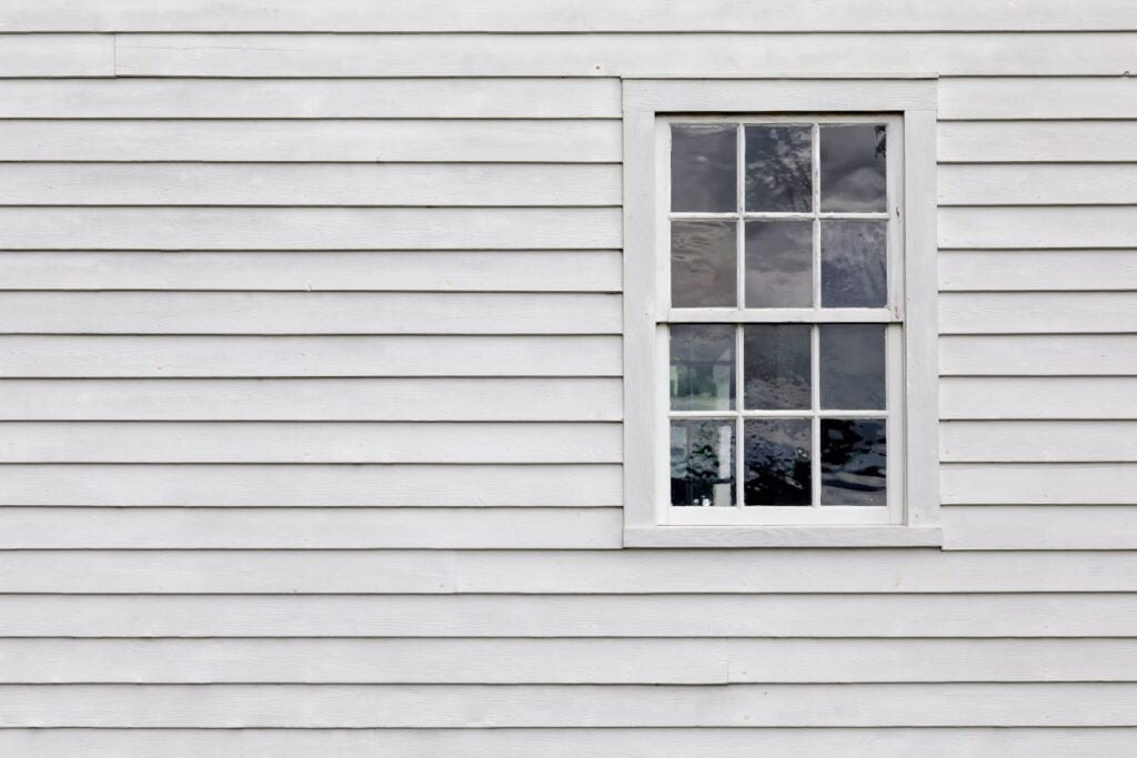 white siding wall with window