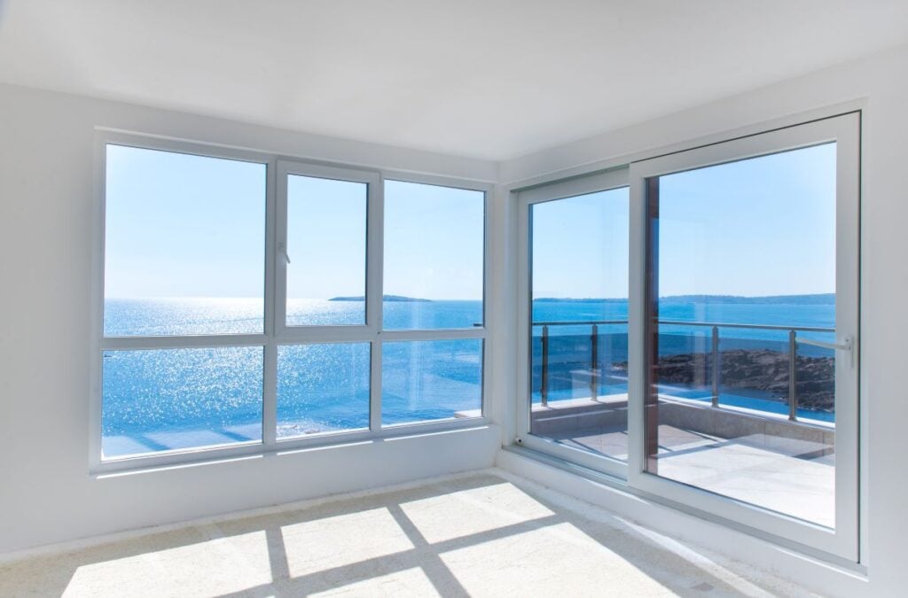 most energy efficient windows big white windows walls in front of sea
