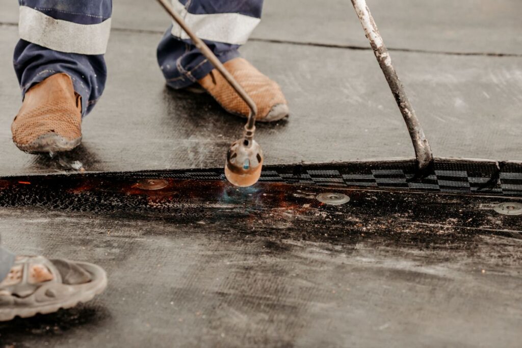 roofer replacing a commercial roof