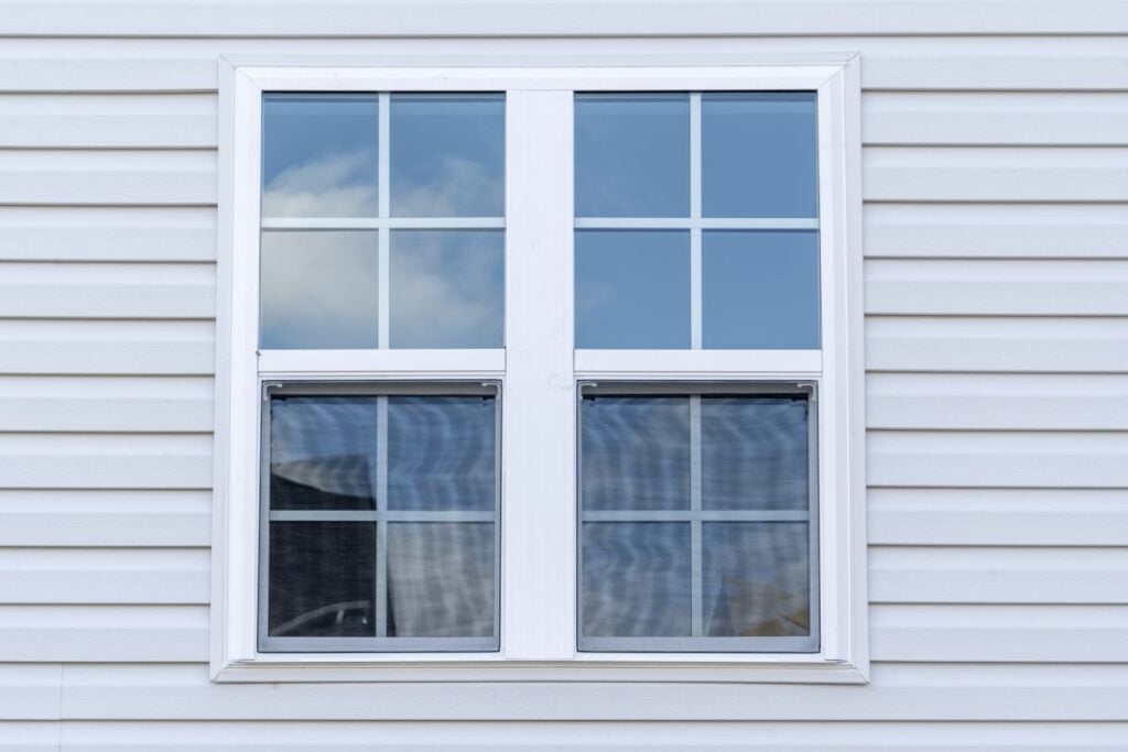 window replacement cost squared window white frame grey siding