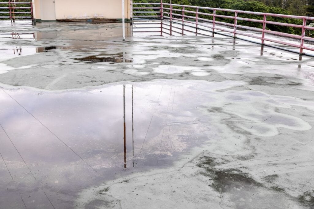 Old flat roof is ponding water and leakage after rain