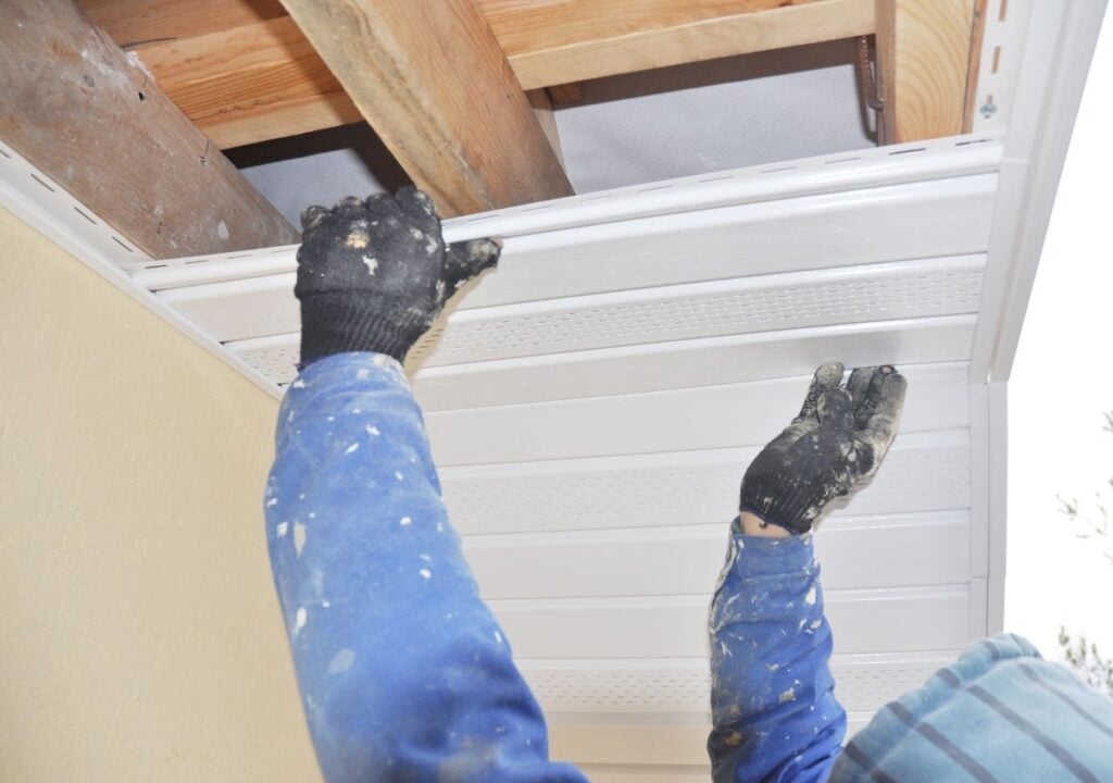 Contractor installing soffit and fascia boards