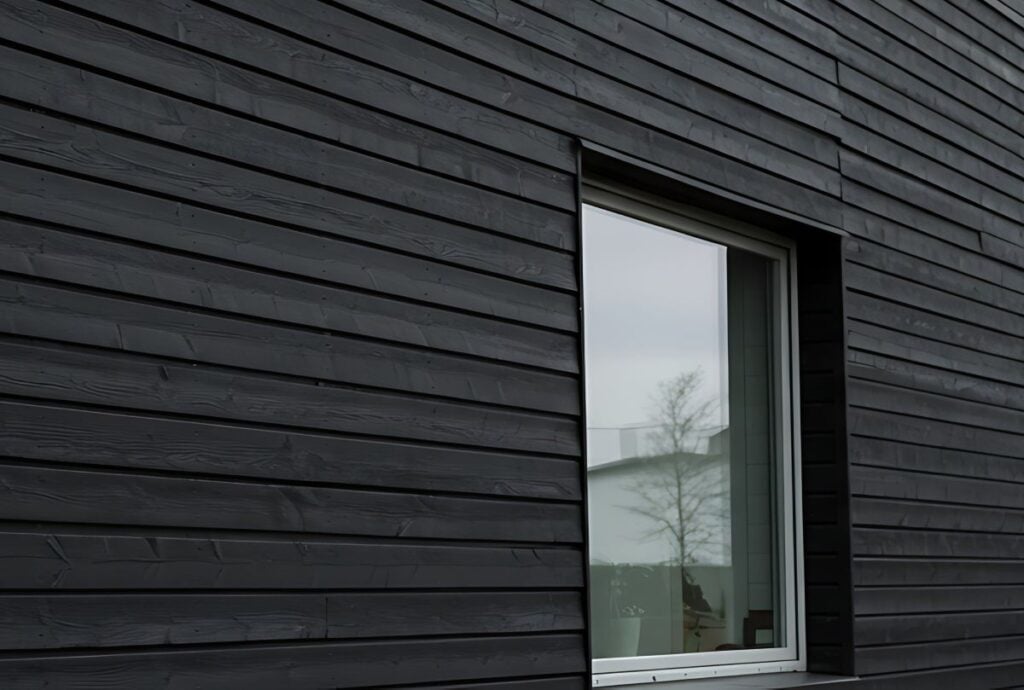 Dark Grey Modern House Exterior with Black Wood Siding and Windows