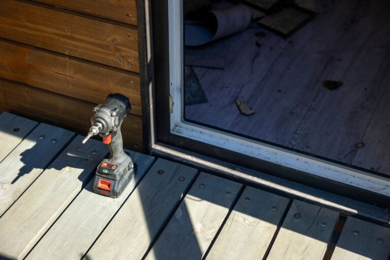 driver on wooden deck at private house entrance, sunny outdoor workspace