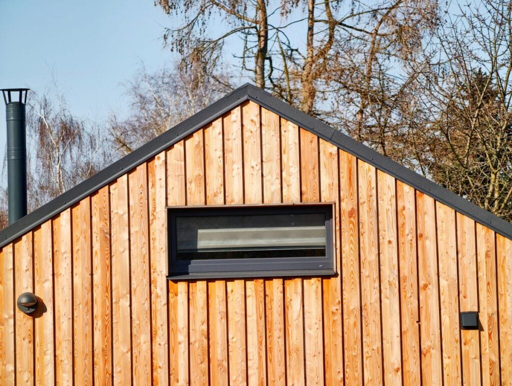 tiny house with cedar clapboard siding