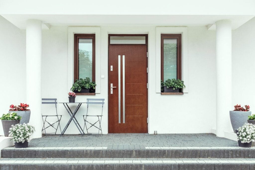 Designer entrance door to a country house. Modern design.