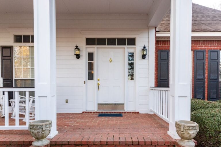 Front door and porch of a residential home. Types of Exterior Doors