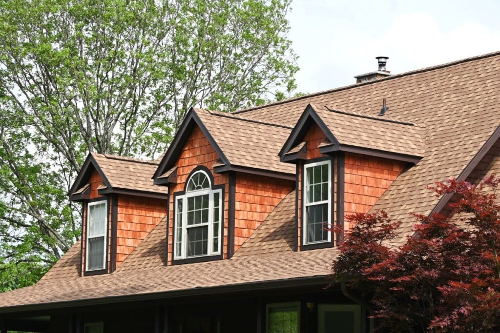 House with a newly installed cedar shake siding