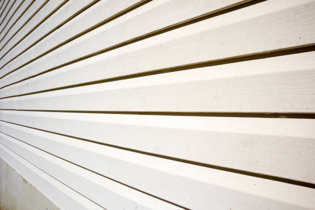 House with pale yellow vinyl siding, James Hardie Siding Colors
