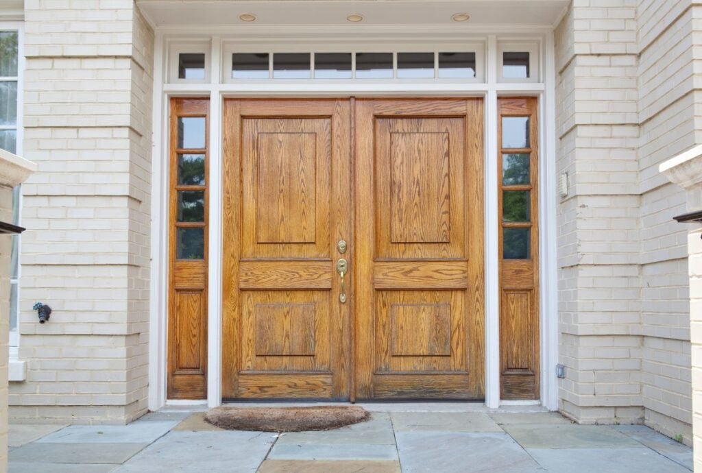Wooden Double Door Grand Entrance to a Home. Types of Exterior Doors