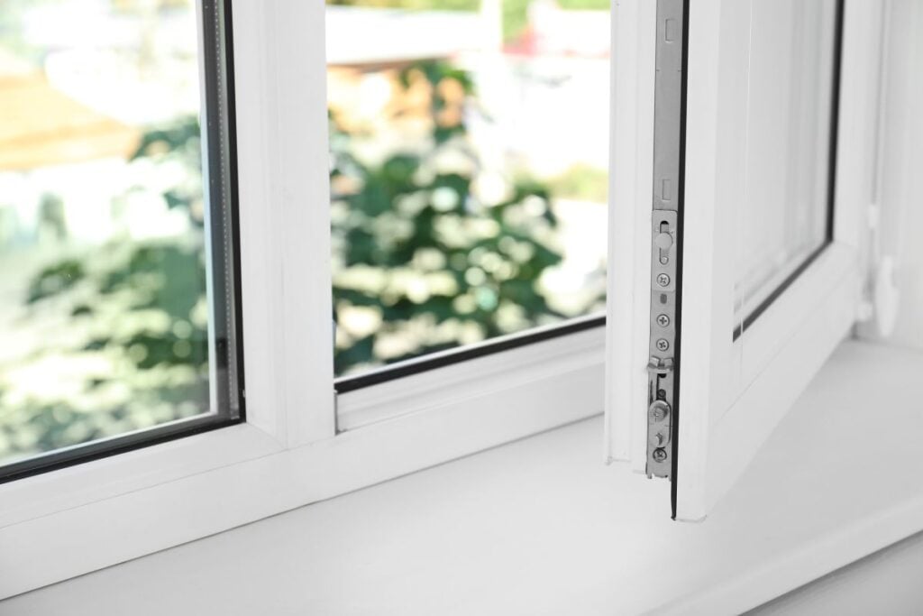 an open white window and an empty white window sill
