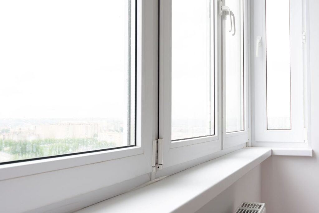 close up view of white windows and white windowsills