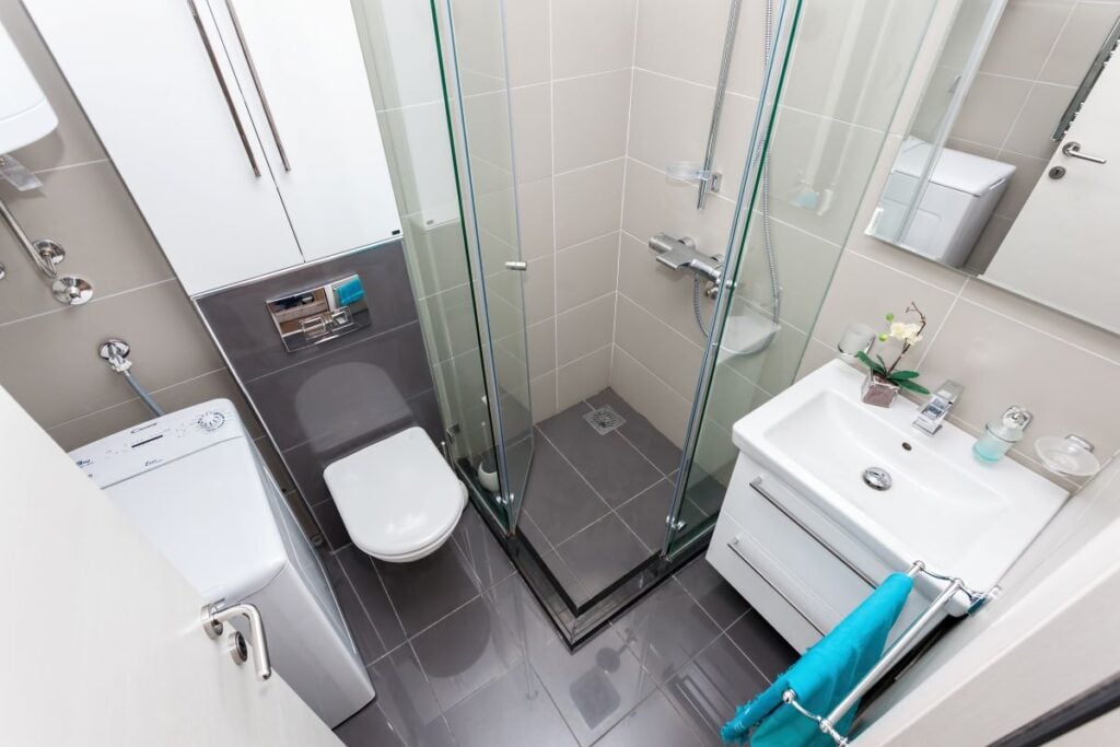 Interior of small modern bathroom with shower
