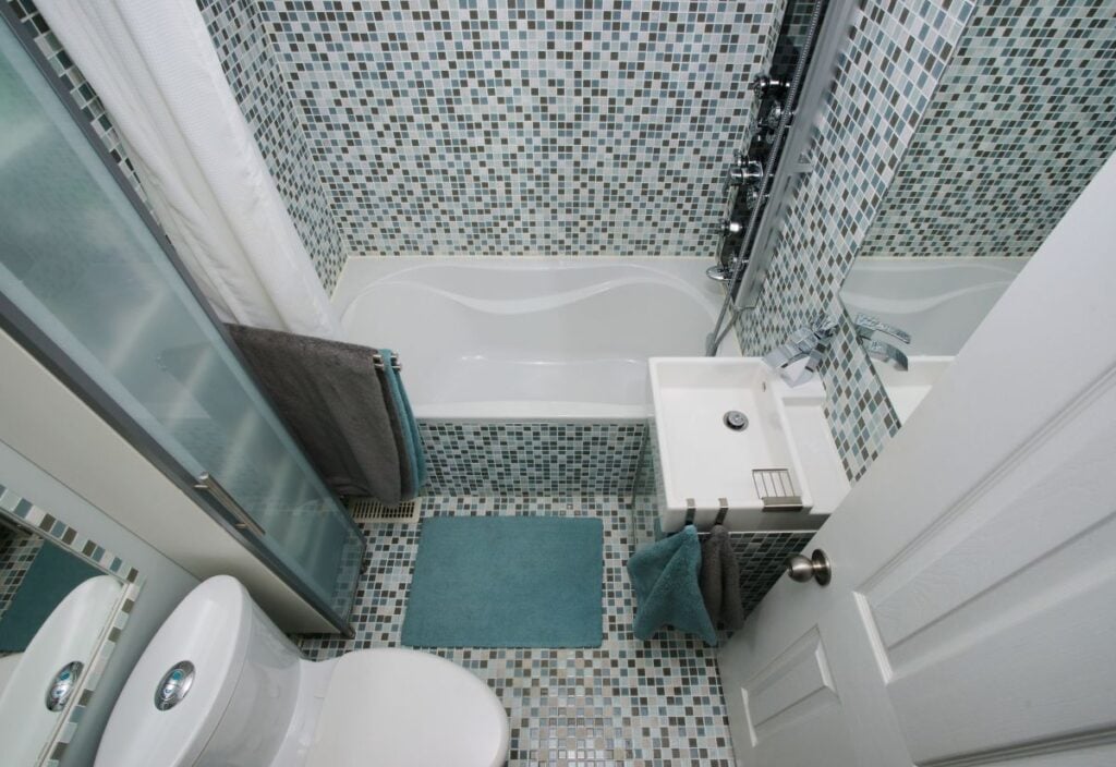 Small, modern bathroom interior. Mosaic tiles.
