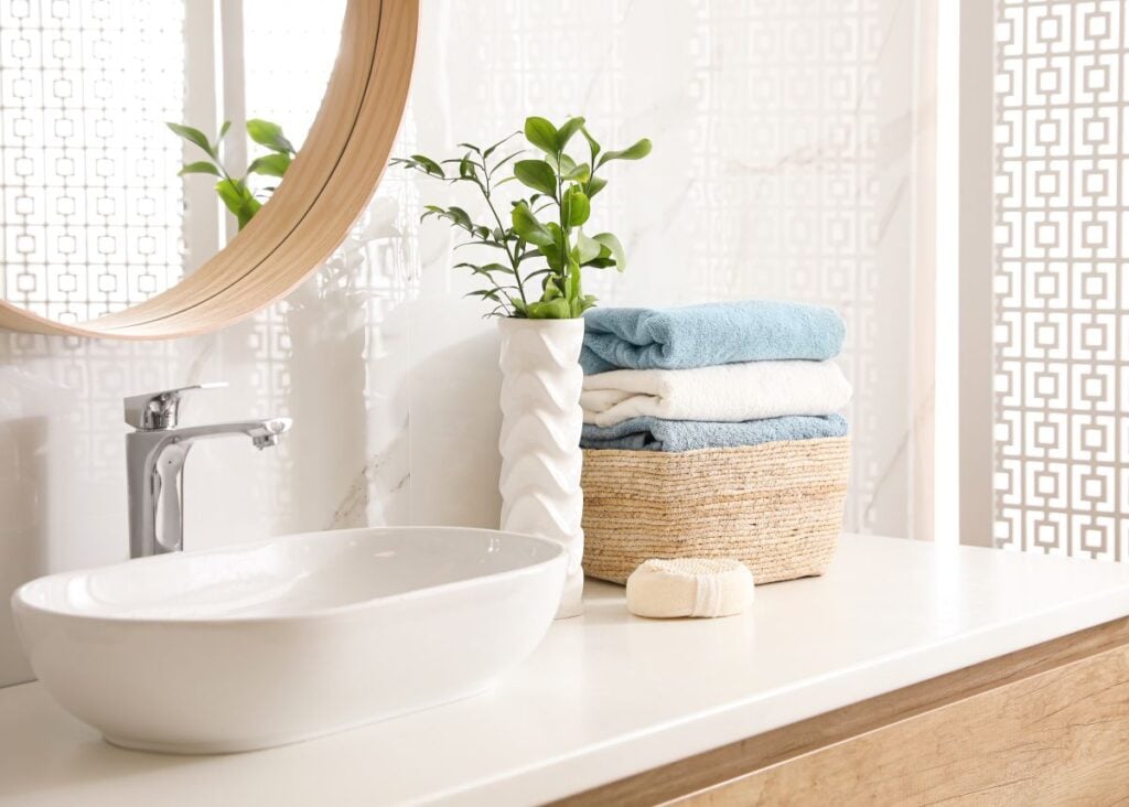 Stylish bathroom interior with mirror and countertop