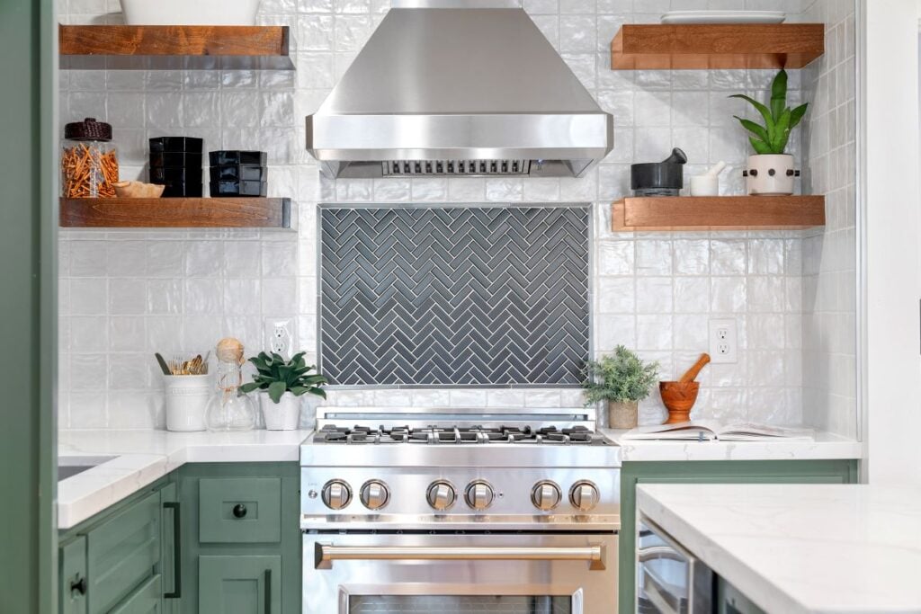 White square tiled kitchen corner surrounded by Kitchen appliances, two shelves, and a book. Kitchen Remodel Cost