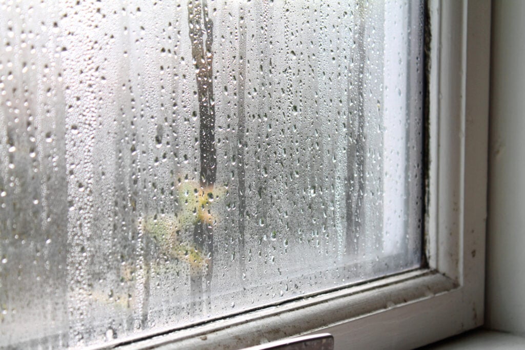 Condensation water on window glass on the inside of the house