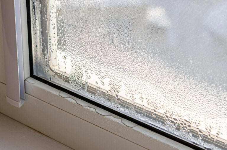 Drops of condensation on a metal-plastic window