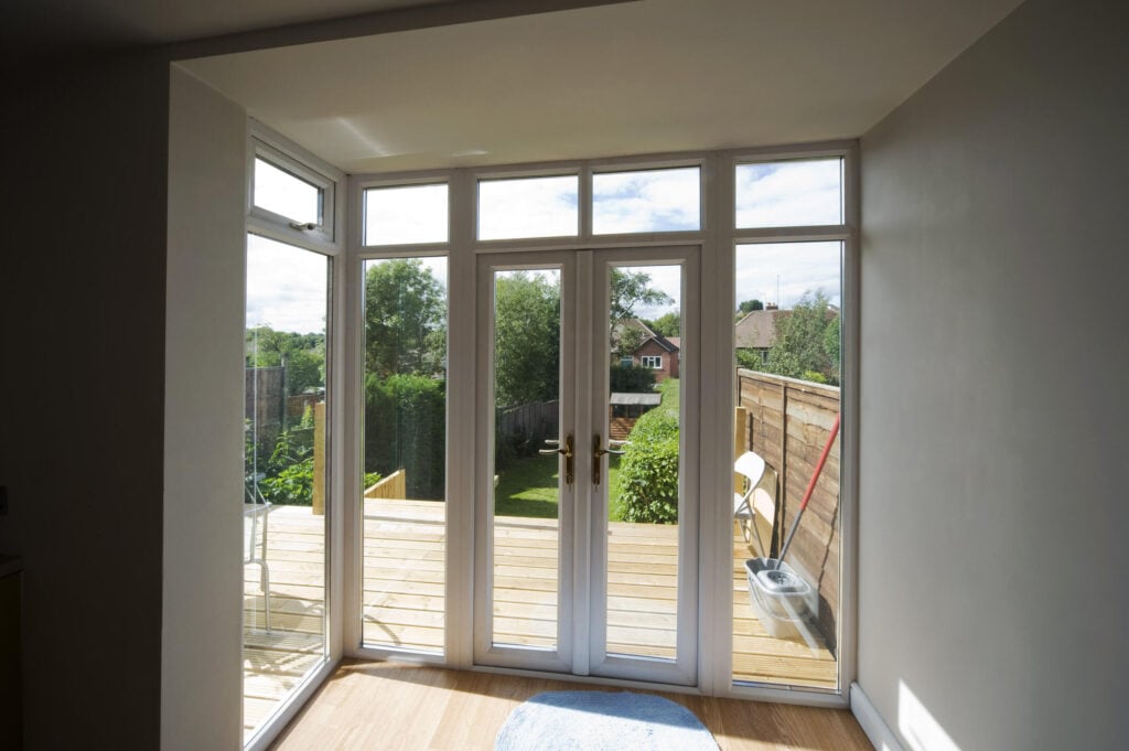 French doors leading to a backyard