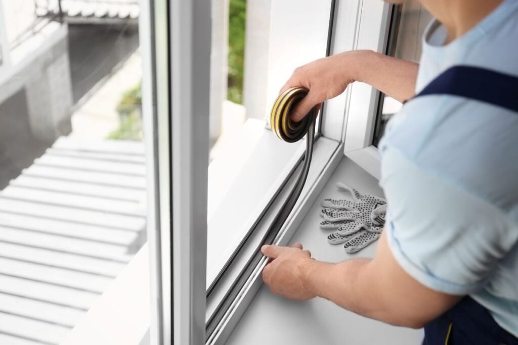sealing foam tape on window indoors